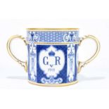 ROYAL CROWN DERBY; a large early 20th century George V Coronation loving cup, dated 1911, pattern