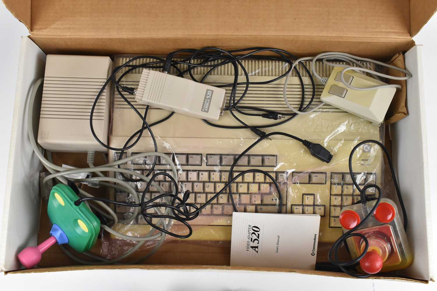 COMMODORE 500; a boxed computer console with two controllers and six arcade games. - Image 2 of 5