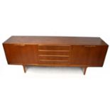 MCINTOSH; a mid-century teak sideboard, with four central drawers flanked by a pair of cupboard