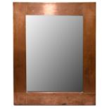 A modern Arts and Crafts style sheet copper rectangular wall mirror, 51 x 41cm.