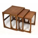 A nest of three mid-century teak coffee tables, height of tallest 48cm, width 54cm, depth 44cm.