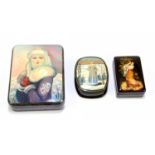 Three 20th century Russian lacquered boxes, the largest example decorated with a Snow Queen,