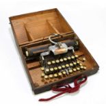 BLICK; a US made aluminium feather weight typewriter, in an oak case.