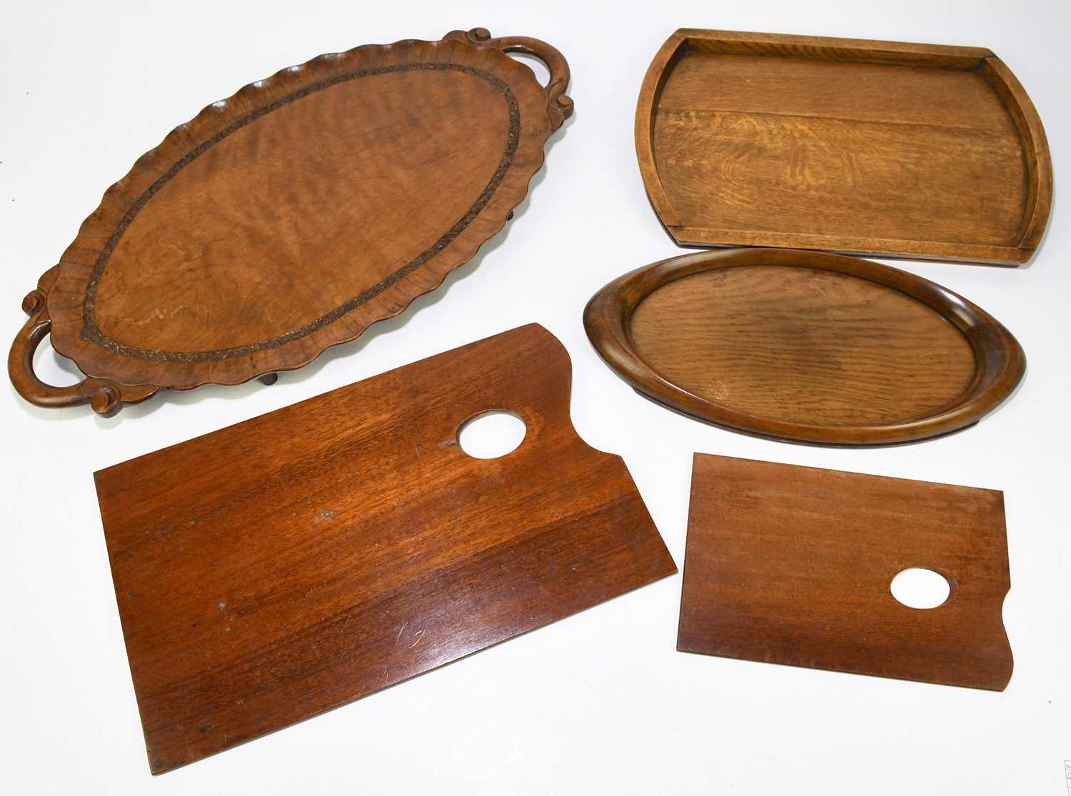 A small collection of treen, to include an early 20th century Indian twin handled tray, further