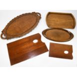 A small collection of treen, to include an early 20th century Indian twin handled tray, further