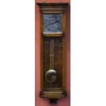 M.D LEVERTON, YORKSHIRE; a reproduction oak cased twin weight wall clock, the silvered dial set with