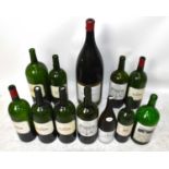 A collection of twelve empty large size wine bottles to include seven Château Margaux, height of