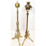 Two 19th century adjustable standard lamps, one example with pierced detail terminating on paw feet,