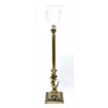 A 19th century brass table lamp, with cut glass shade on a single Corinthian column terminating on a