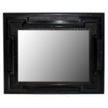 A 20th century ebonised wall mirror, 70 x 59cm.