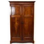 A late Victorian mahogany two door wardrobe, with moulded cornice on base with bracket feet,