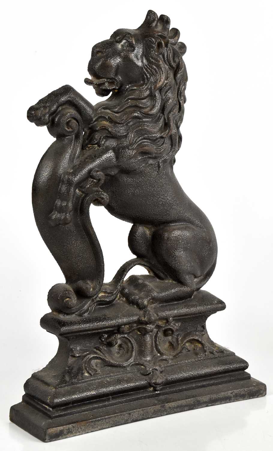 A cast iron doorstop modelled as a lion rampant, height 38cm.