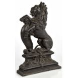 A cast iron doorstop modelled as a lion rampant, height 38cm.