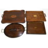 Three 20th century inlaid oak butler's trays of shaped rectangular form, largest 57cm, also a twin