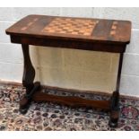 An early Victorian inlaid rosewood games table with chess board top and cribbage markers to the