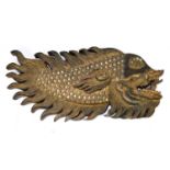 An Indian carved and simulated jewel decorated wall mounted stylised fish, length 80cm.