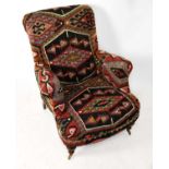 A Victorian style armchair, upholstered in a Caucasian wool material with geometric design.Condition