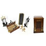 An Edwardian carved walnut purdonium, height 49cm, with a selection of fireside tools and