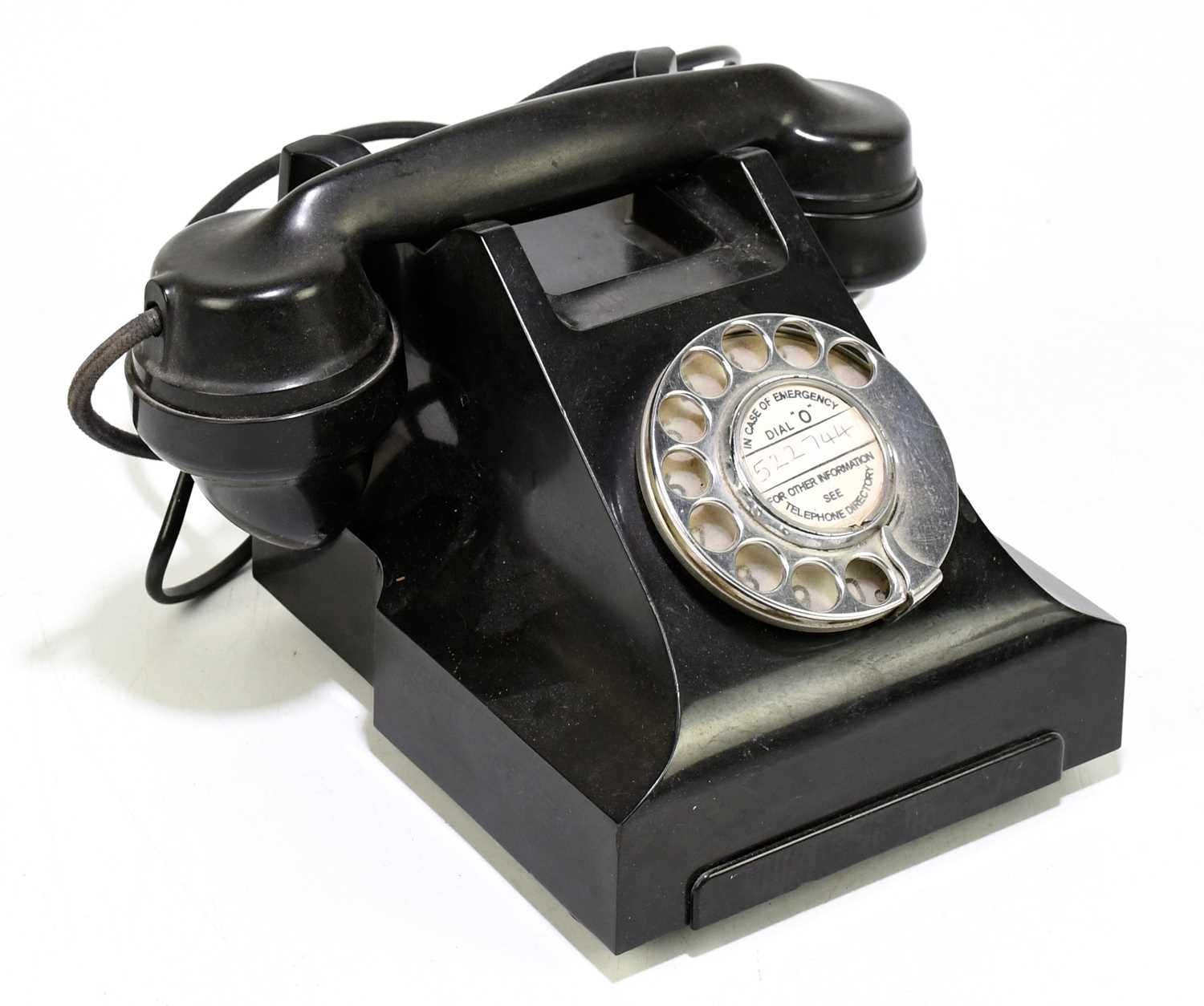 A vintage bakelite telephone.