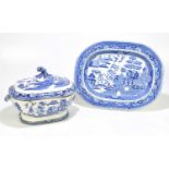 A 19th century blue and white ironstone meat plate decorated in the 'Willow' pattern, together