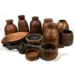 A collection of 20th century Indian hardwood vases, bowls and vessels.