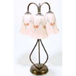 An early 20th century silver plated three branch table lamp, with three hand painted glass shades,