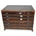 An oak six drawer plan chest on block legs, width 119cm, depth 84cm, height 90cm.Condition Report: A