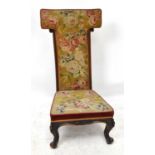 A Victorian carved walnut salon chair with tapestry back and seat on cabriole legs, height 103cm.