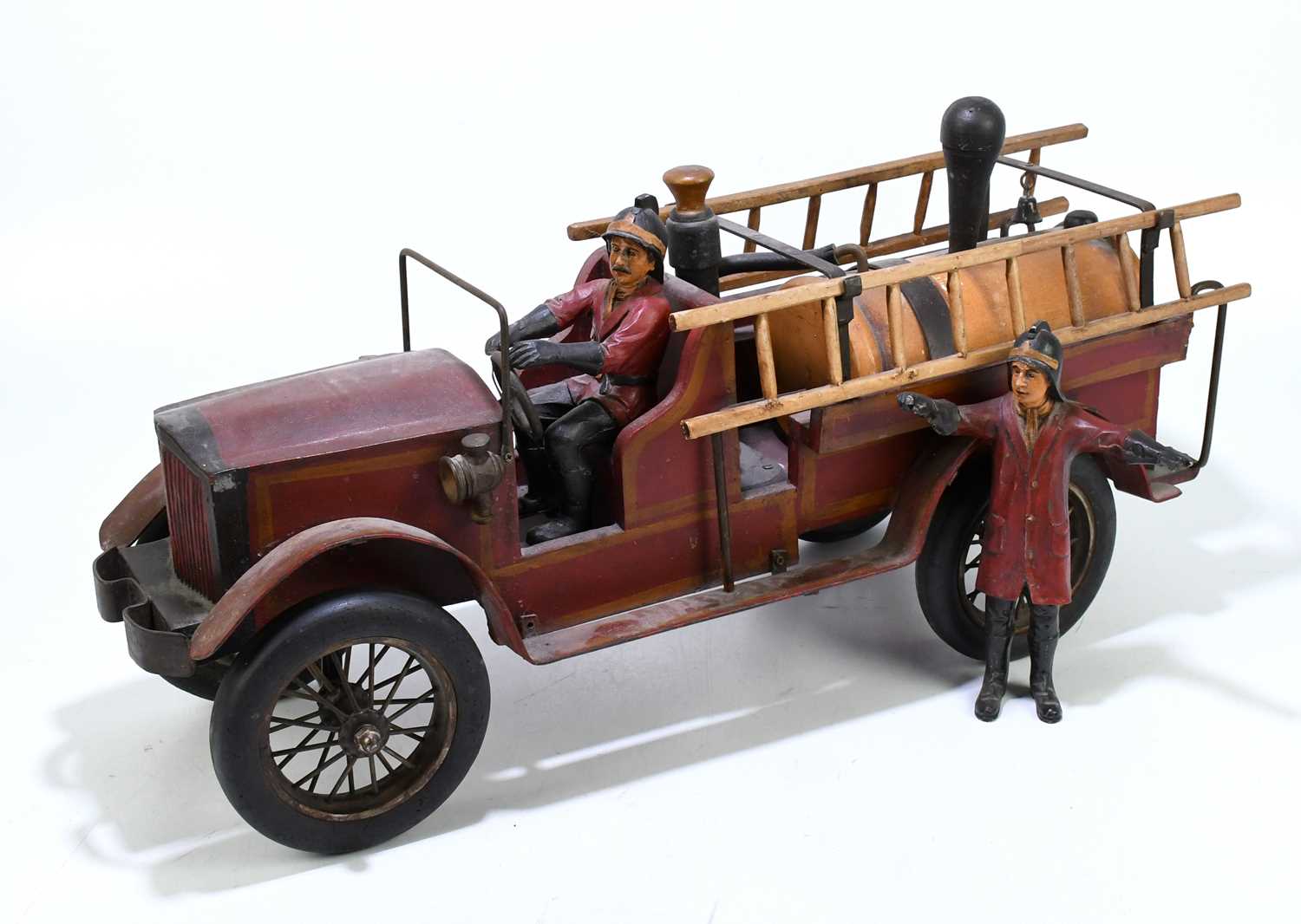 A modern carved wood, metal and composite model of a fire engine, length 70cm.Condition Report: