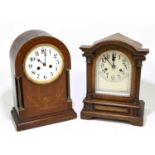 A late 19th century German oak cased dome topped mantel clock, the silvered dial set with Arabic