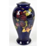 MOORCROFT; an inverted baluster form table lamp decorated in the 'Clematis' pattern, impressed