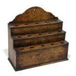 A George III style stepped oak spoon rack, with fifteen spaces for spoons, height 36cm, width 35cm.