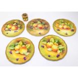 COALPORT; five hand painted scalloped edged cabinet plates, decorated with fruit, each signed by