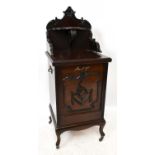 A Victorian carved mahogany coal purdonium with shaped raised back above a pull-down front (