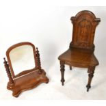 A Victorian carved oak hall chair with panelled shield back together with a Victorian mahogany