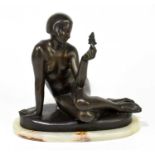 A reproduction Art Nouveau style bronze figure of a nude maiden holding a butterfly, on onyx