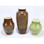 ROYAL LANCASTRIAN; three mid-century vases designed by John Brannon, two in brown and one in