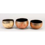 † ANNE JAMES (born 1937); a trio of small raku rocking bowls with lustrous decoration, incised AJ