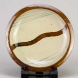 Leach Pottery; a large stoneware wave plate, impressed pottery mark, diameter 29.5cm.Condition