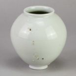 † ADAM BUICK (born 1978); a miniature porcelain moon jar covered in celadon glaze decorated with