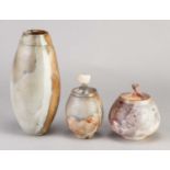 † ARDINE SPITTERS (born 1953); a smoke fired earthenware vessel with orange and grey surface,