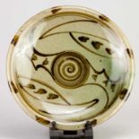 † ARA CARDEW (born 1962) for Wenford Bridge Pottery; a stoneware plate decorated with a spiral to