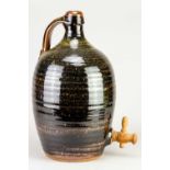 † Attributed to RAY FINCH (1914-2012) for Winchcombe Pottery; a large stoneware cider flagon covered