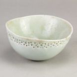 † ALAN WALLWORK (1931-2019); a porcelain bowl covered in celadon glaze with a band of impressed