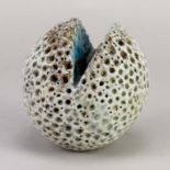 † ALAN WALLWORK (1931-2019); a stoneware split sphere with impressed decoration partially picked out