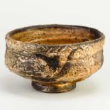 CHARLES BOUND (born 1939); a large wood fired stoneware chawan covered in shino and green ash