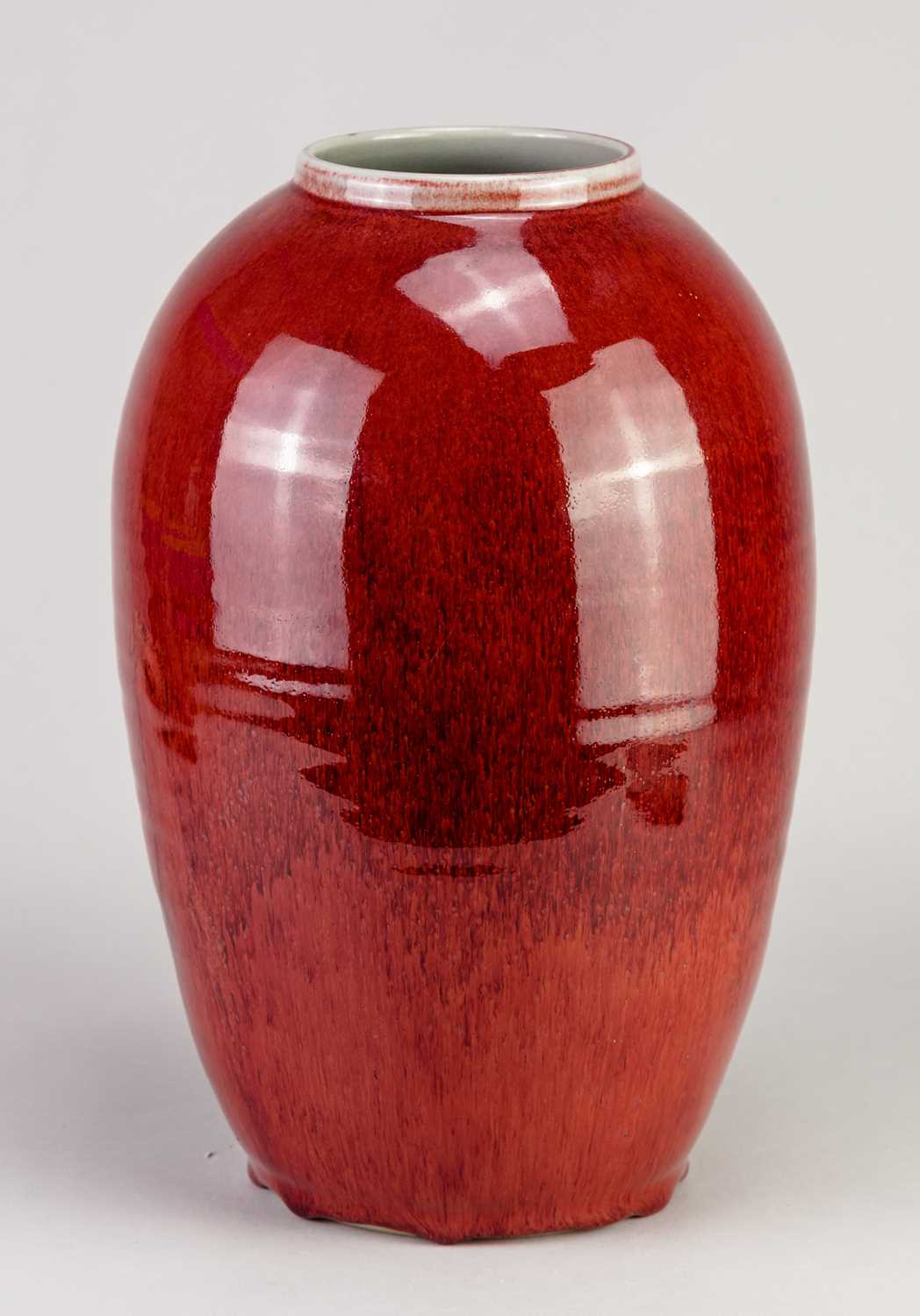 † RUPERT SPIRA (born 1960); a tall stoneware baluster vase covered in copper red glaze with