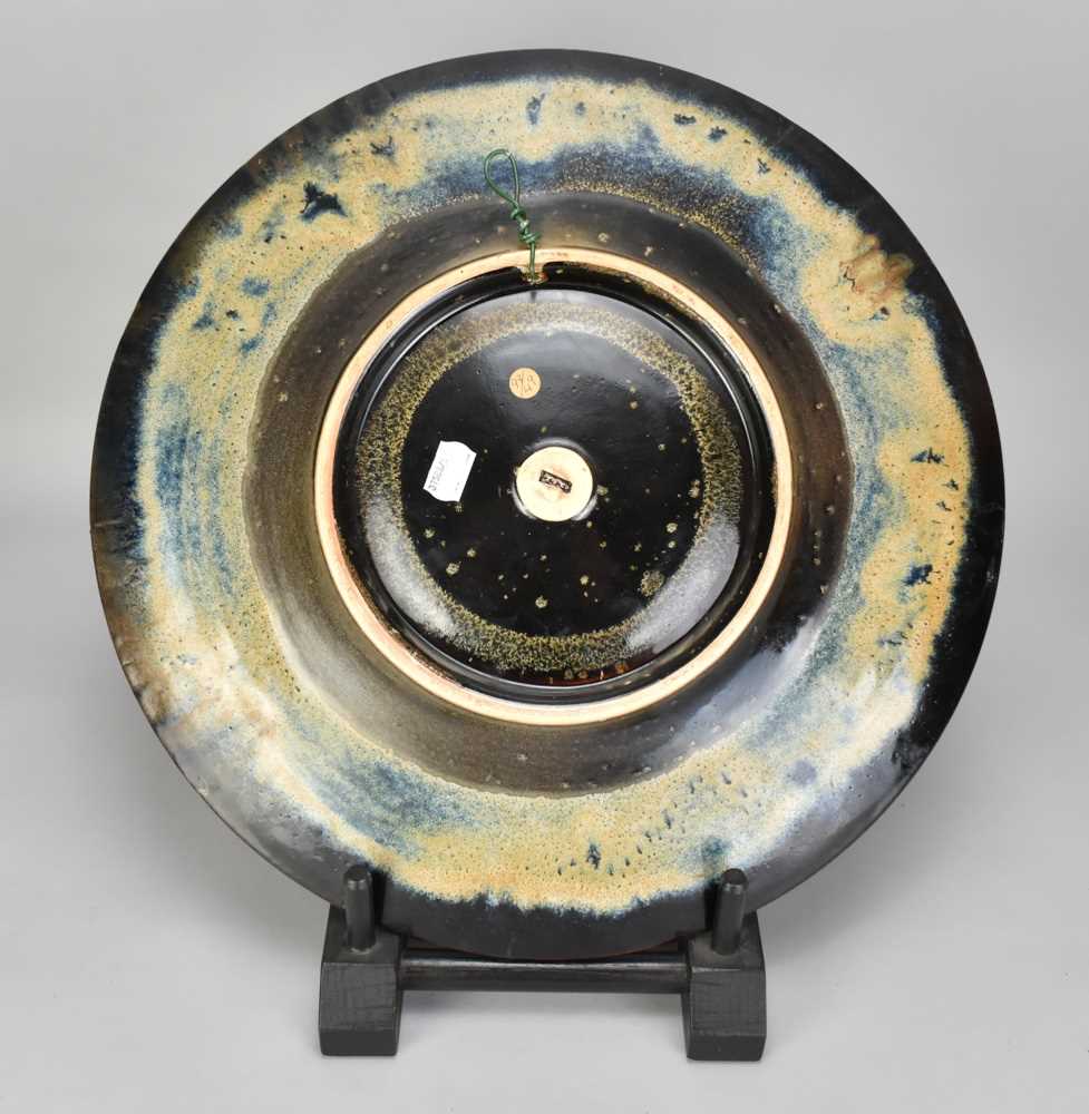 † ABDO NAGI (1941-2001); a stoneware charger/wall hanging covered in mottled yellow and blue glaze - Image 3 of 4