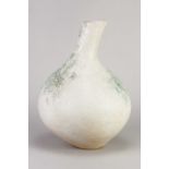 † BETTY BLANDINO (1927-2011); a globular stoneware vessel with elongated neck covered in off white