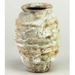 † AKI MORIUCHI (born 1947); a ribbed stoneware vessel with heavily textured surface, impressed mark,